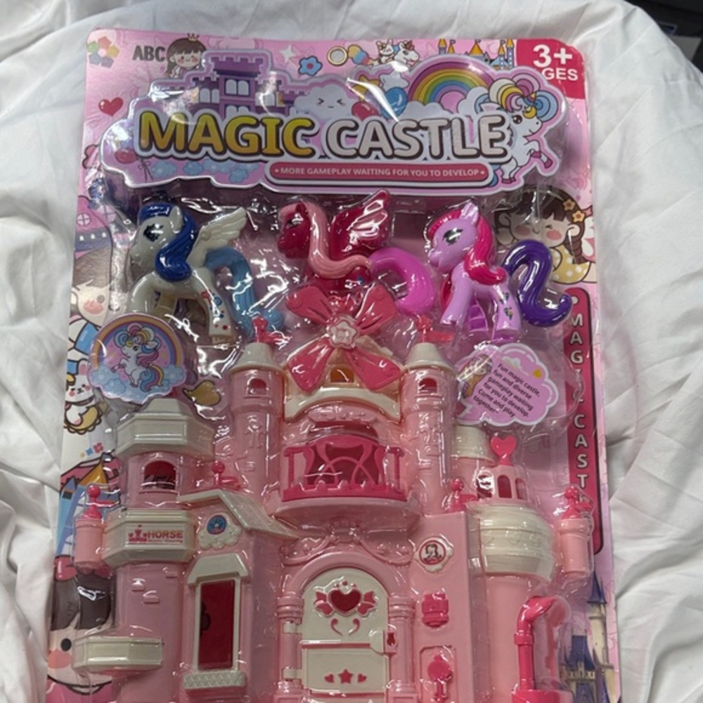 Magic Castle little pony’s blue red and purple with large pink white castle
